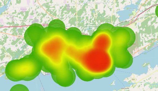 eat map of Kingston, Ontario region showing extremely high concentrations of students in red near Queen's University and downtown, fading to low concentrations in green.